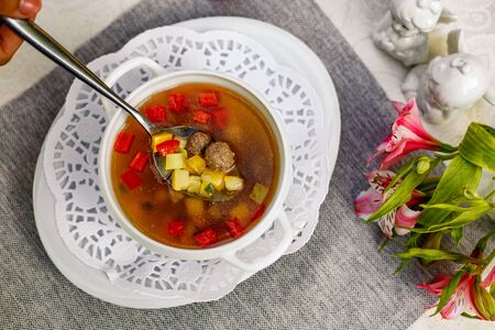 soup with vegetables and meatballs for lunchの写真素材