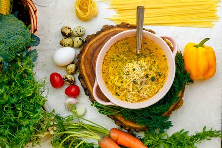 noodle soup with chicken on wooden standの写真素材