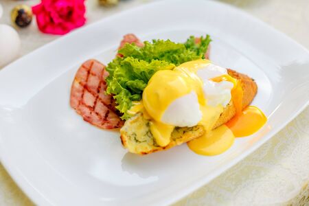 breakfast with garlic cheese bread, with egg salad leaves and baconの写真素材