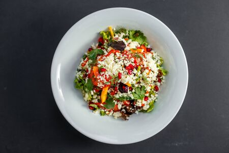 vegetarian salad healthy food with pomegranate cheese and pepperの写真素材