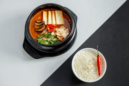 korean dish spicy soup with beef and vegetables with rice and hot pepper