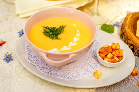 cheese soup with crackers on the holiday tableの写真素材
