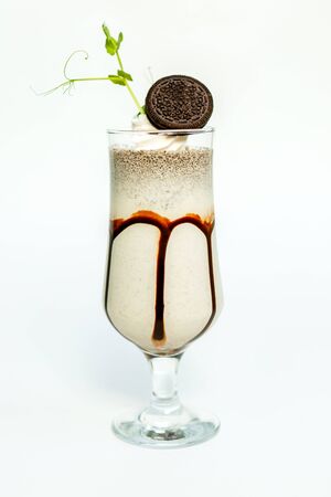 delicious milk milkshake with chocolate and cookies, with cream, isolatedの写真素材
