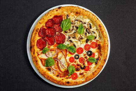 hot italian pizza with cheese and basil, isolatedの写真素材