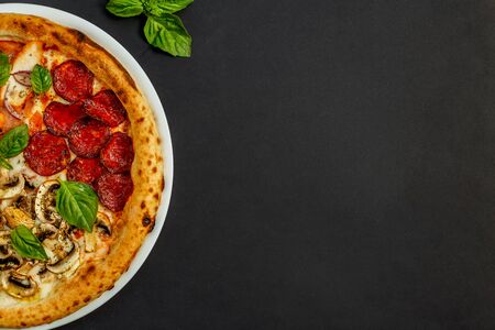 hot italian pizza with cheese and basil, isolatedの写真素材