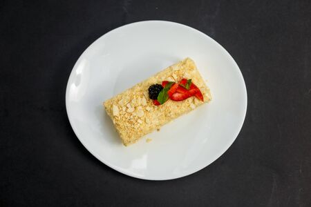 a slice of honey cake with berries, sweet dessertの写真素材
