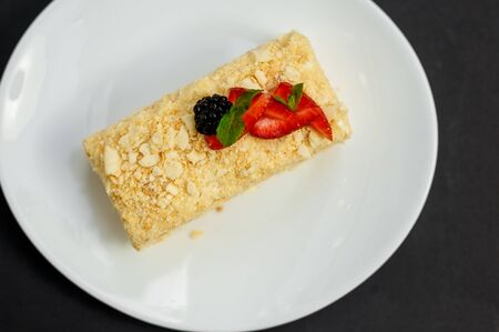 a slice of honey cake with berries, sweet dessertの写真素材