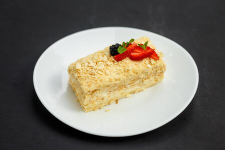 a slice of honey cake with berries, sweet dessertの写真素材