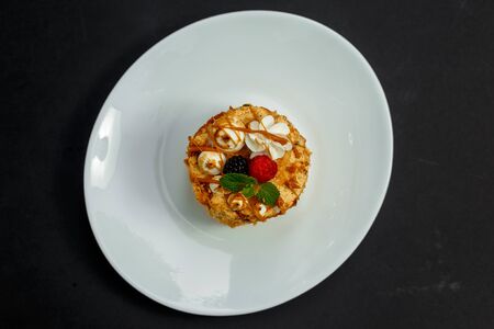 sweet cheesecake with honey caramel, berries and mint, dessertの写真素材