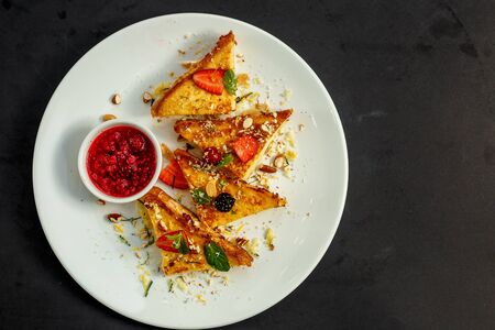 delicious toasts with cheese, fruit and raspberry jam, breakfastの写真素材