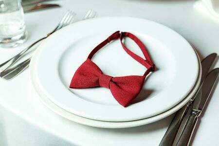 table decoration for a holiday, red bow tieの写真素材