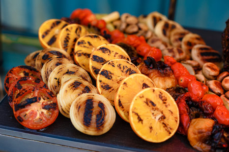 grilled vegetables, peppers, mushrooms, onions and tomatoes, healthy vegetarian foodの写真素材