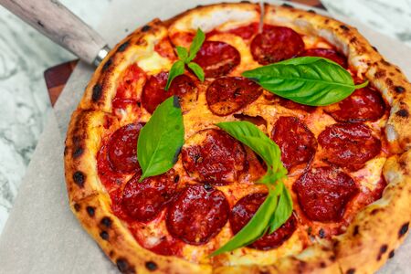 Italian pizza with mozzarella and basilの写真素材