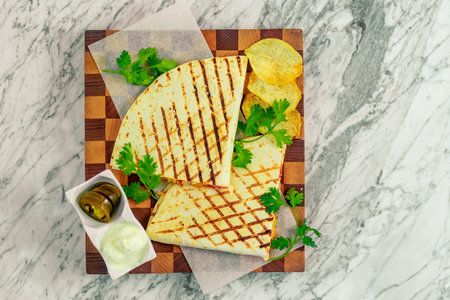 quesadillas with vegetables and jalapenos with sauceの写真素材