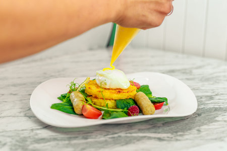 Vegetable pancake with chicken nipples and boiled egg. Breakfastの写真素材
