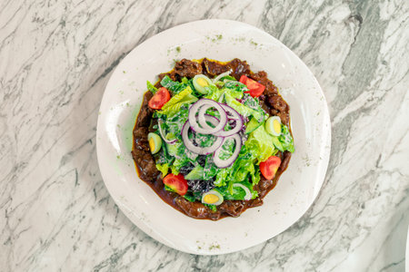 salad with stew, eggs and vegetablesの写真素材