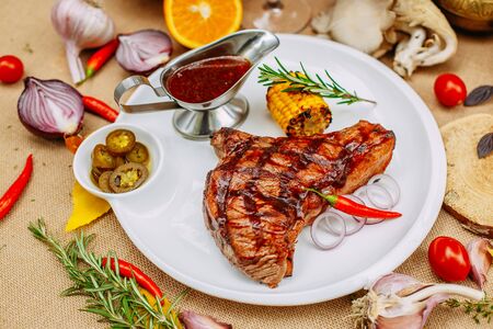 Autumn table setting with pumpkins. Thanksgiving dinner. Steak with Vegetablesの写真素材