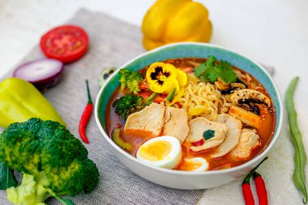 ramen noodles with korean noodles served on the tableの写真素材