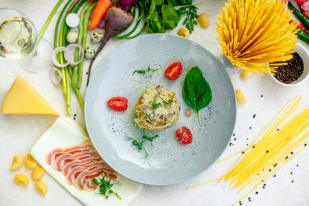 Italian pasta carbonara served on a table with ingredients
