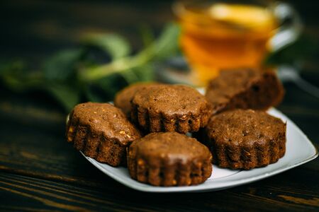 homemade cakes, chocolate muffins with mint and tea with lemonの写真素材