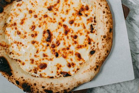 hot italian pizza on marble tableの写真素材