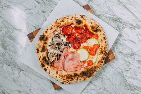 hot italian pizza on marble tableの写真素材