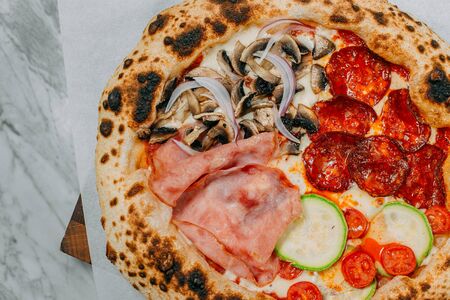 hot italian pizza on marble tableの写真素材