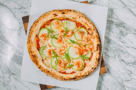 hot italian pizza on marble tableの写真素材