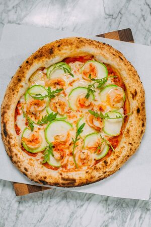 hot italian pizza on marble tableの写真素材