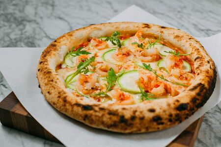 hot italian pizza on marble tableの写真素材