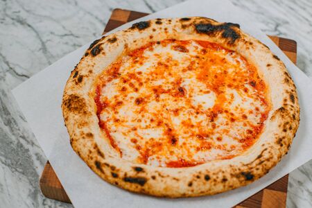 hot italian pizza on marble tableの写真素材