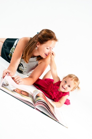 Young mother with daughter in studioの写真素材
