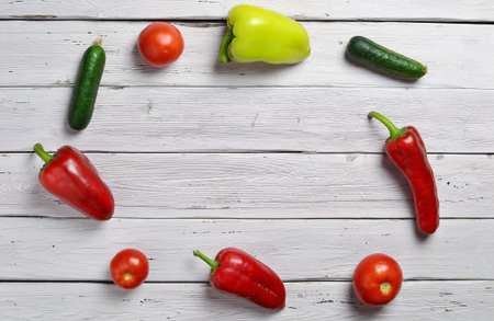 Fresh raw ingredients arranged in a circle on the white rustic wooden table, top view, copy space, selective focusの写真素材
