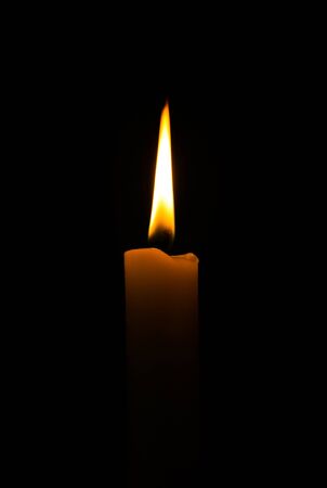 The perfect candle flame with black backgroundの写真素材