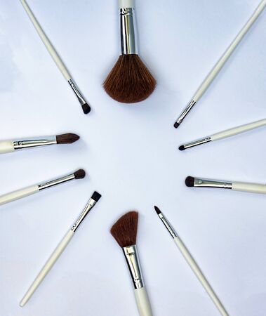 Set of makeup brushes  on a light background with a copy space in a circle form の写真素材