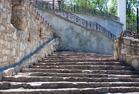 There are old steps paved with stones near the church. Its sunny weather outsideの写真素材