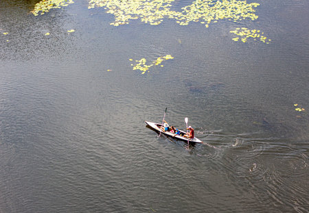 Ivanovsky Bridge, Ukraine - June 21, 2020: Concept of Extreme Sports and Fun , canoe with two people...