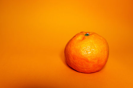 fresh orange on orange background surface. Conceptual photo about young and old age, inner beauty,...