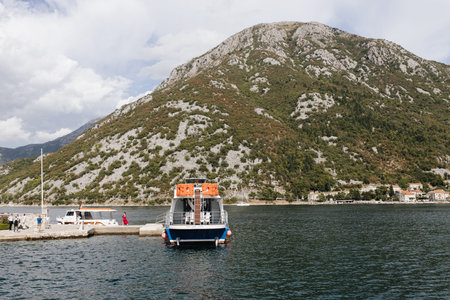Perast, Montenegro - 15.09.2021: Tourists sailed on a yacht to the island of gospa od skrpela in the...