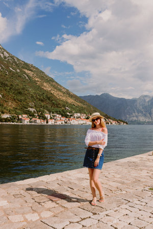 Lady on the island in The Bay of Kotor, the Adriatic Sea in southwestern Montenegro. Its...