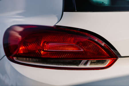 Closeup of taillight after washing. Contactless self-service car wash concept. Personal car care cleaning. Concept disinfection and antiseptic cleaning of the vehicle, covid-19 and coronavirusの写真素材