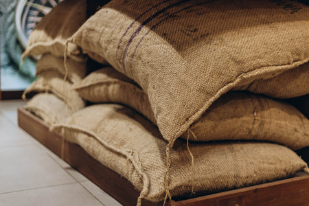 Villajoyosa, Spain - May 16, 2023: Pile of sacks of cocoa at exhibition at the excursion hall in chocolate factory "Valor". Valor - Spanish brand of chocolate and candies.の写真素材