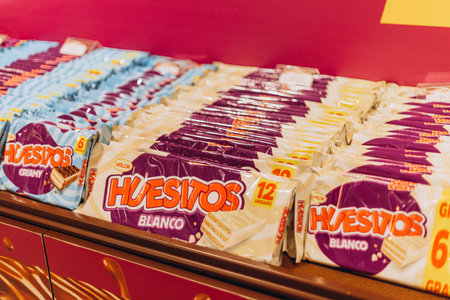 Villajoyosa, Spain - May 16, 2023: exhibition at the shop in chocolate factory "Valor", Huesitos chocolate bars displayedの写真素材