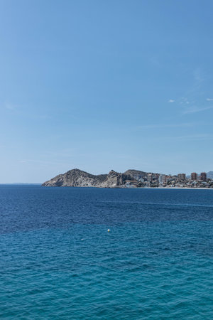 Benidorm, Alicante, Spain. Aerial photo from drone to Benidorm city skyline with beach and mountains in the background. These are the most beautiful views from the drone to the skyscrapersの写真素材