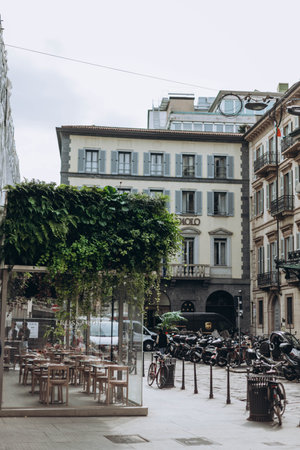 Milan, Italy- May 13, 2023: green leaves, grass on the top of cafe, grass-roofed cafe in historic part om italian cityのeditorial素材