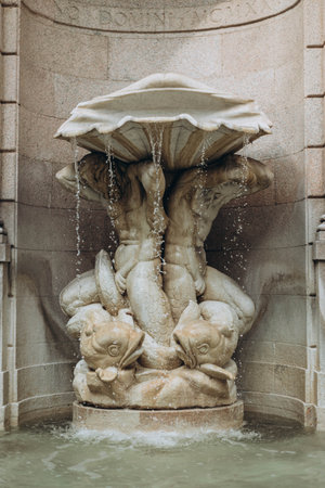Milan, Italy- May 13, 2023: nice fountain located at the convergence of two streets (Andegari and Rospigliosi), a few steps away from via Manzoni and piazza della Scala, Fontana dei Tritoniのeditorial素材