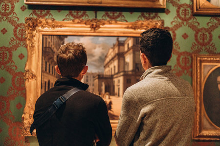 Milan, Italy- May 13, 2023: tourists admires expositions, art in Teatro alla Scala Opera House. The museum at the theatre. Beautiful interior design with pictures , Cultural entertainment, art galleryのeditorial素材