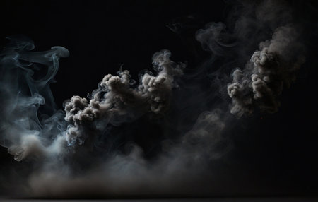 Clouds of white smoke on a black background. Abstract background.の素材