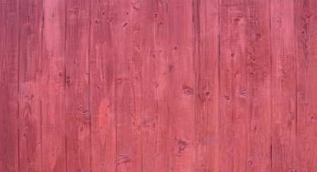 Natural wooden background. Surface of wooden texture for design and decoration. Shabby vertical boards with peeling paint . Crimson color. Copy space.の写真素材