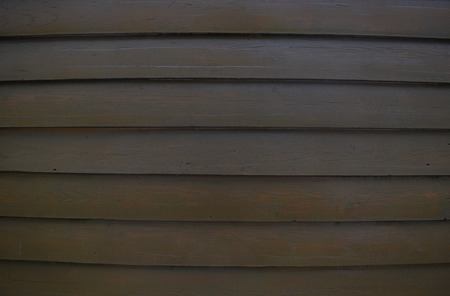 Wooden background. Surface of wooden texture for design and decoration. Horizontal stripes (planks). Dark brown color.の写真素材
